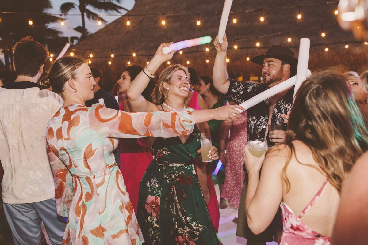 Guests dancing at wedding reception in Cancun