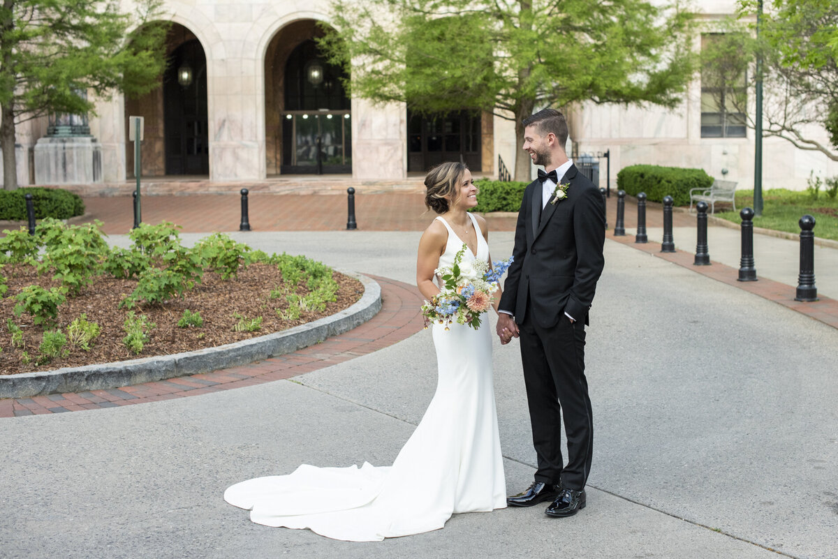 Couple holding hands at Century Room on the Park Asheville wedding