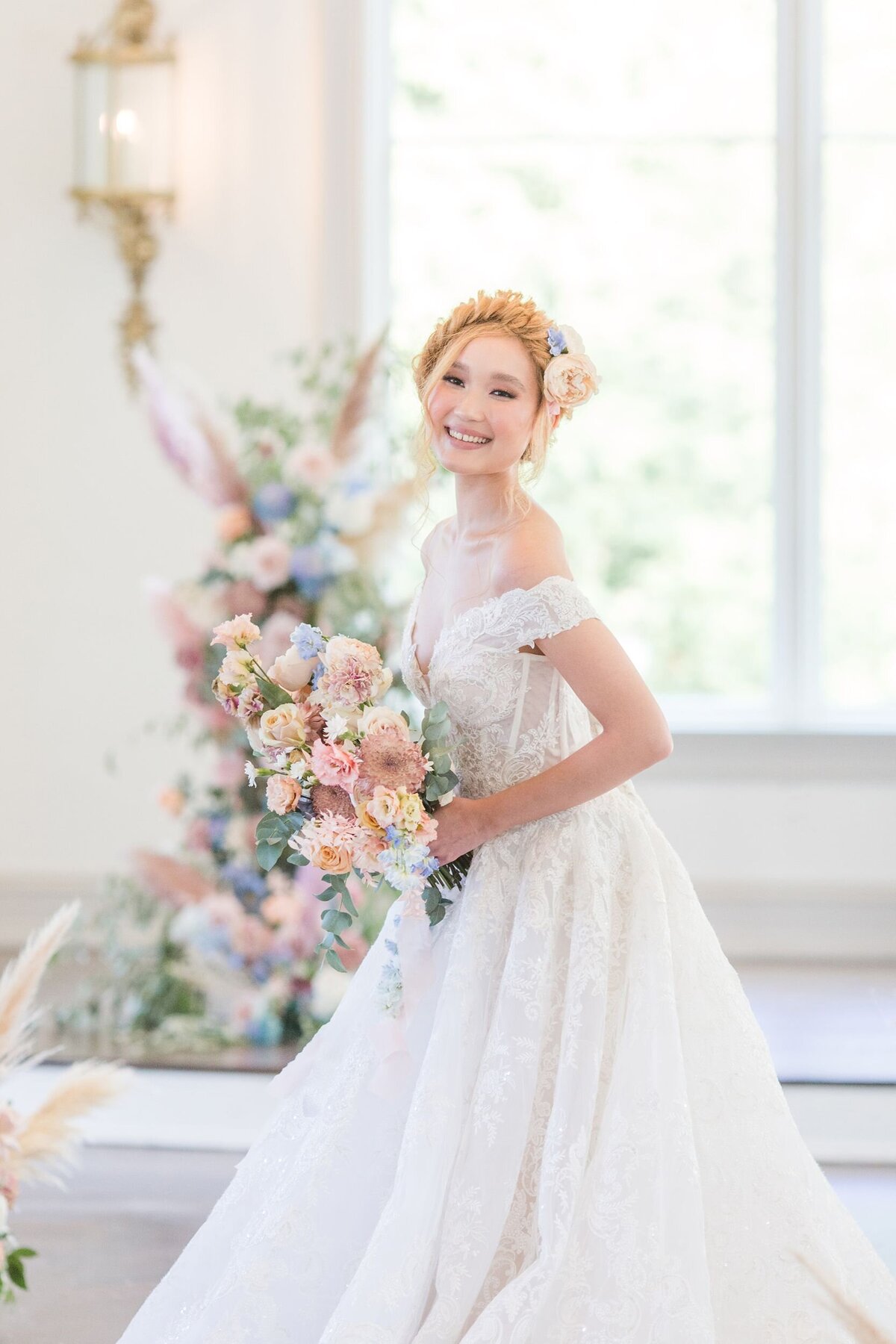 Bride at Park Chateau with pastel flowers