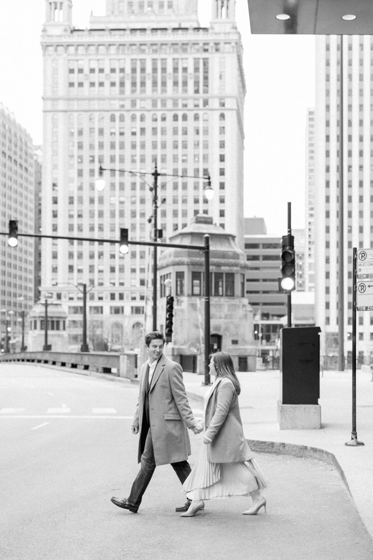 A couple takes a stroll in downtown Chicago on a quiet Sunday morning