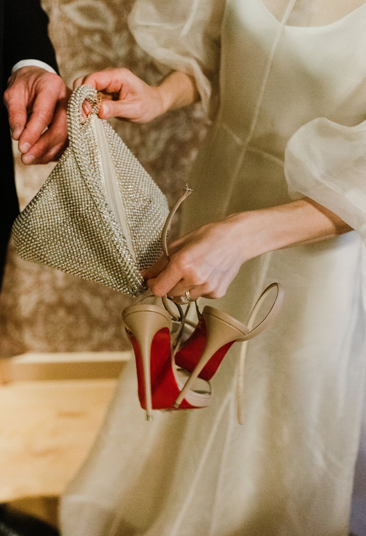 Bride holding wedding shoes ready for wedding in Asutin