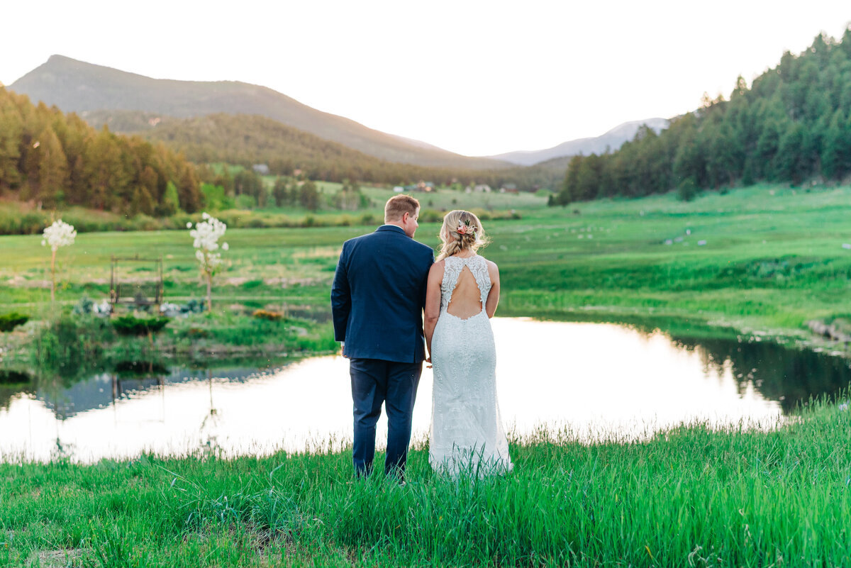 Bride and Groom at pond by Colorado Springs Wedding photographer