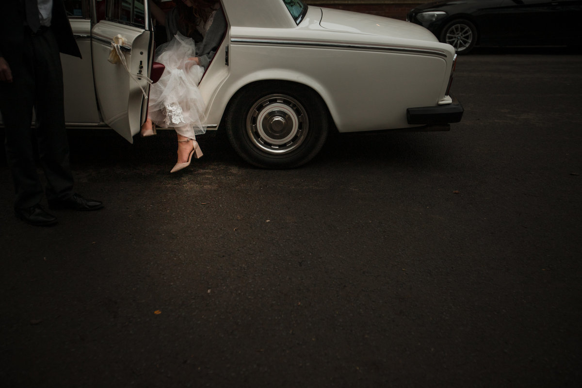 Bride gets out of car