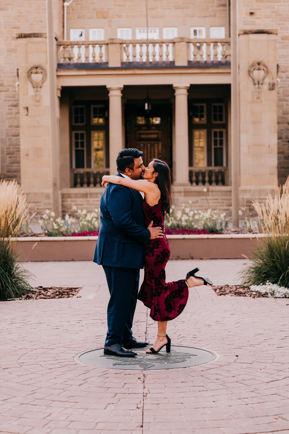 couple kisses in the garden of the Government House in Edmonton  Alberta