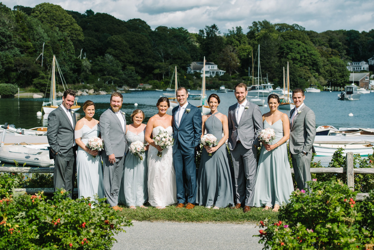 Bridal party with boats in background