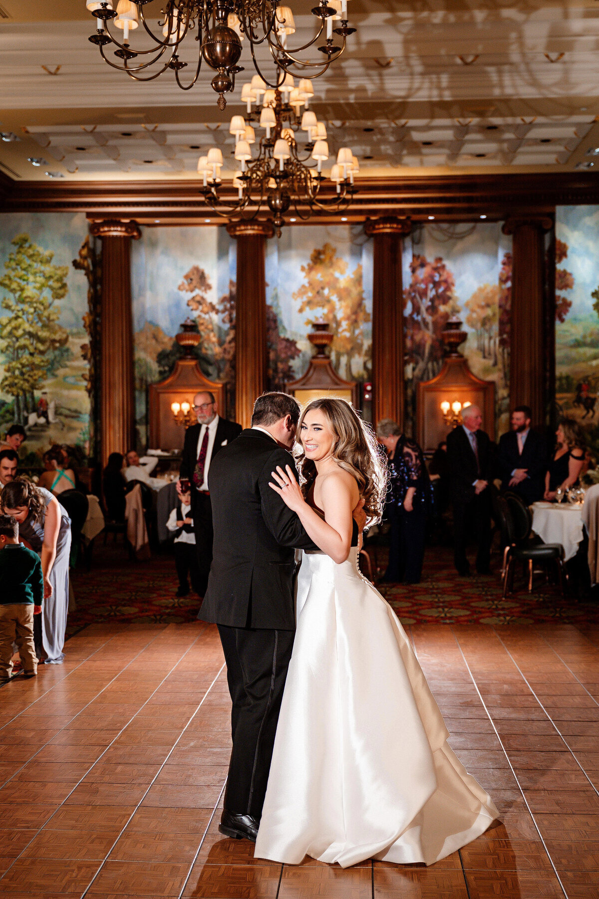 bride and dad dancing together