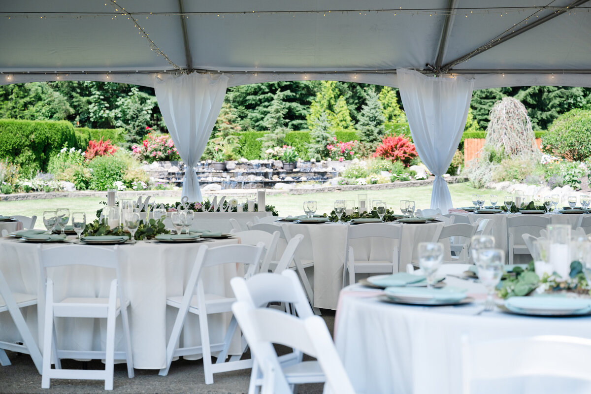garden party wedding tent with round tables set