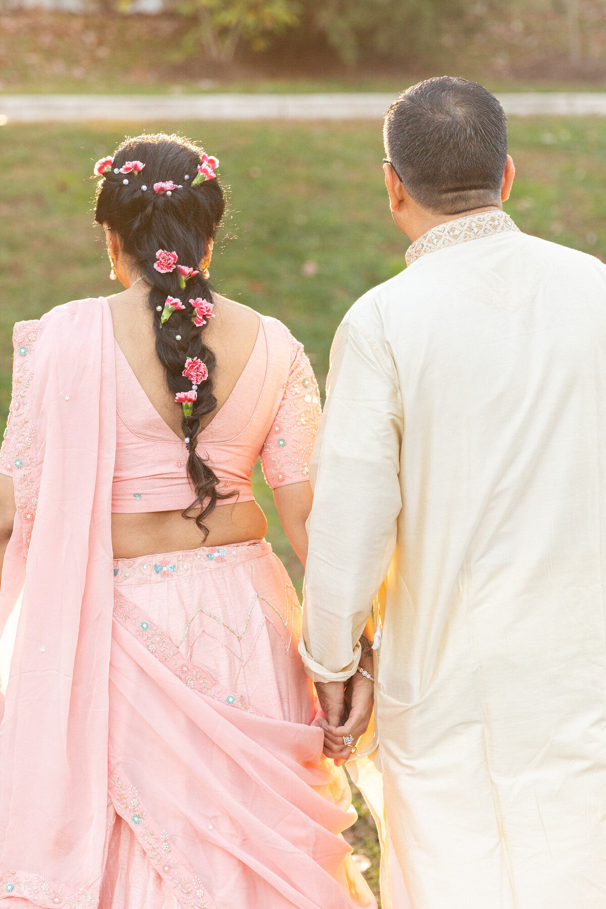 Wedding Anniversary photo couple walking and holding hands during golden hour