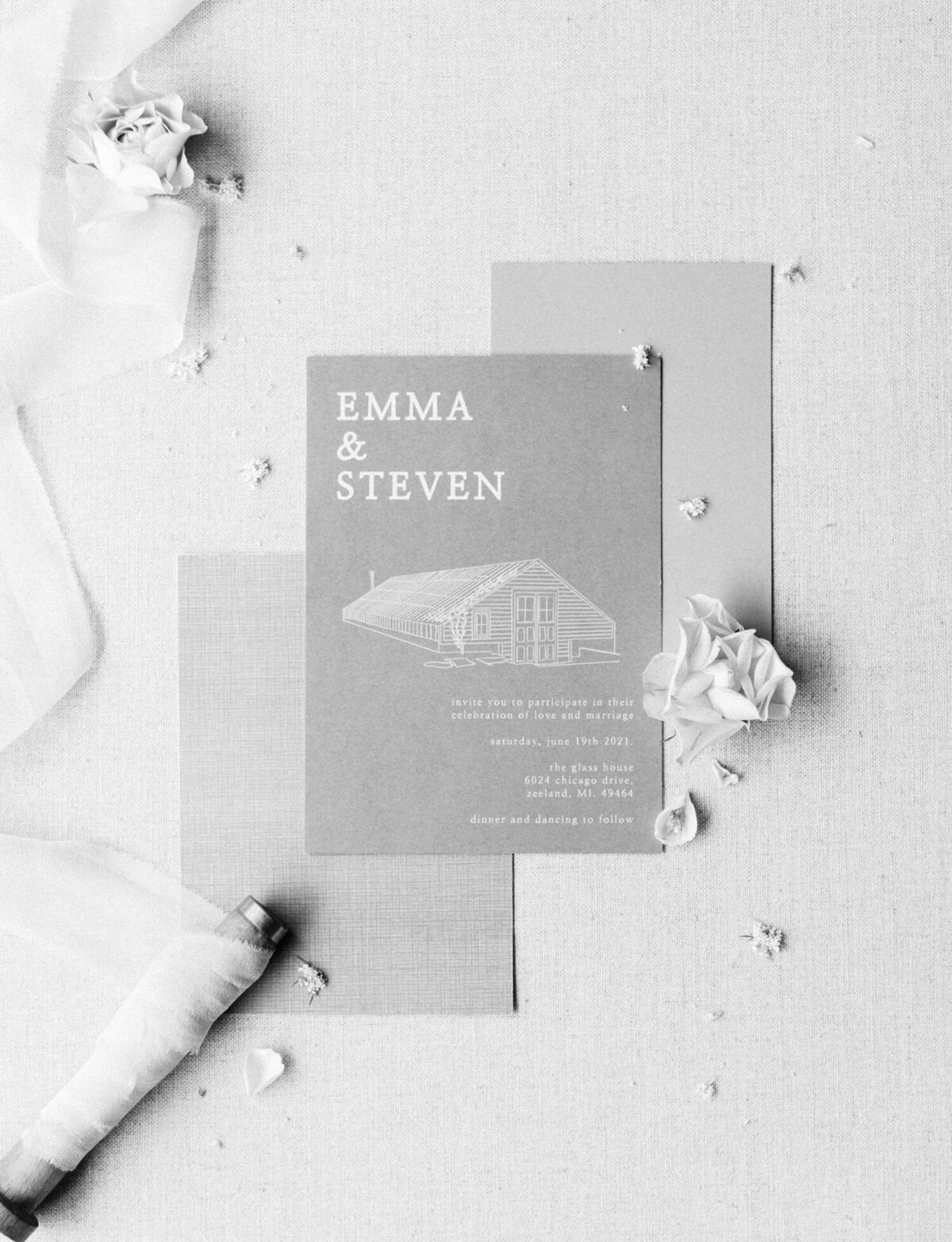 stationery with flowers at Glass House Community, Grand Rapids wedding venue