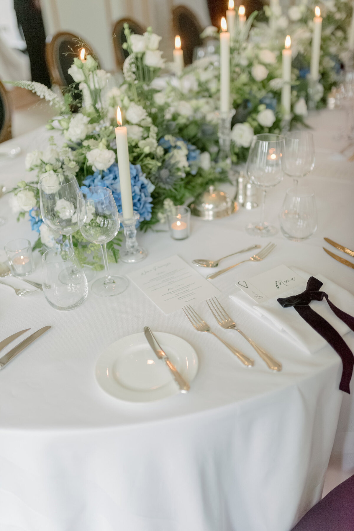 Velvet bows and abundant florals by Wild Burnett on a Gleneagles wedding day. Image by award winning luxury wedding photographer Scotland, Jill Cherry Porter.