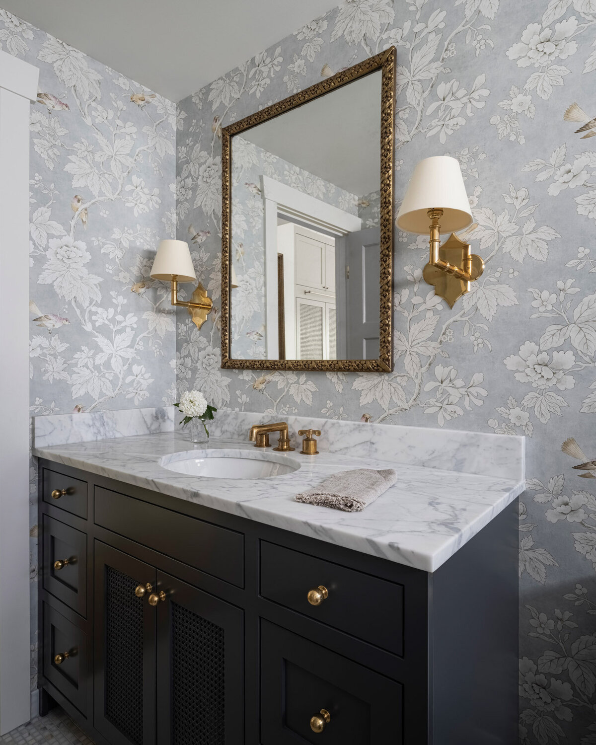 Bathroom-blue-patterened-wallpaper-marble-countertop