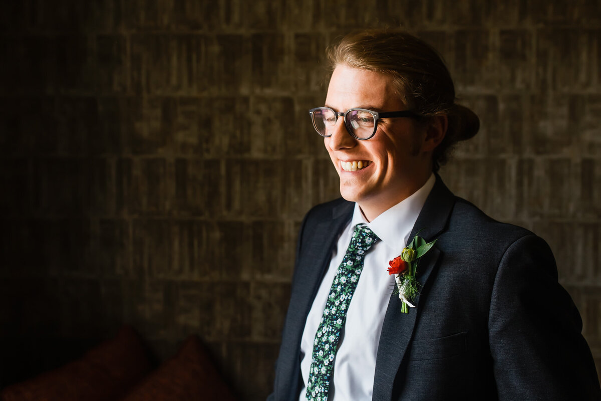 Groom smiling after getting ready before his wedding