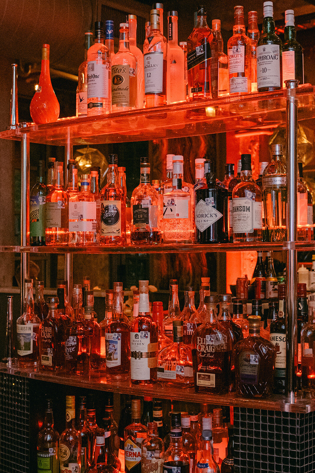 Industrial-style bar with curated bottle styling at upscale wedding in a historic firehouse