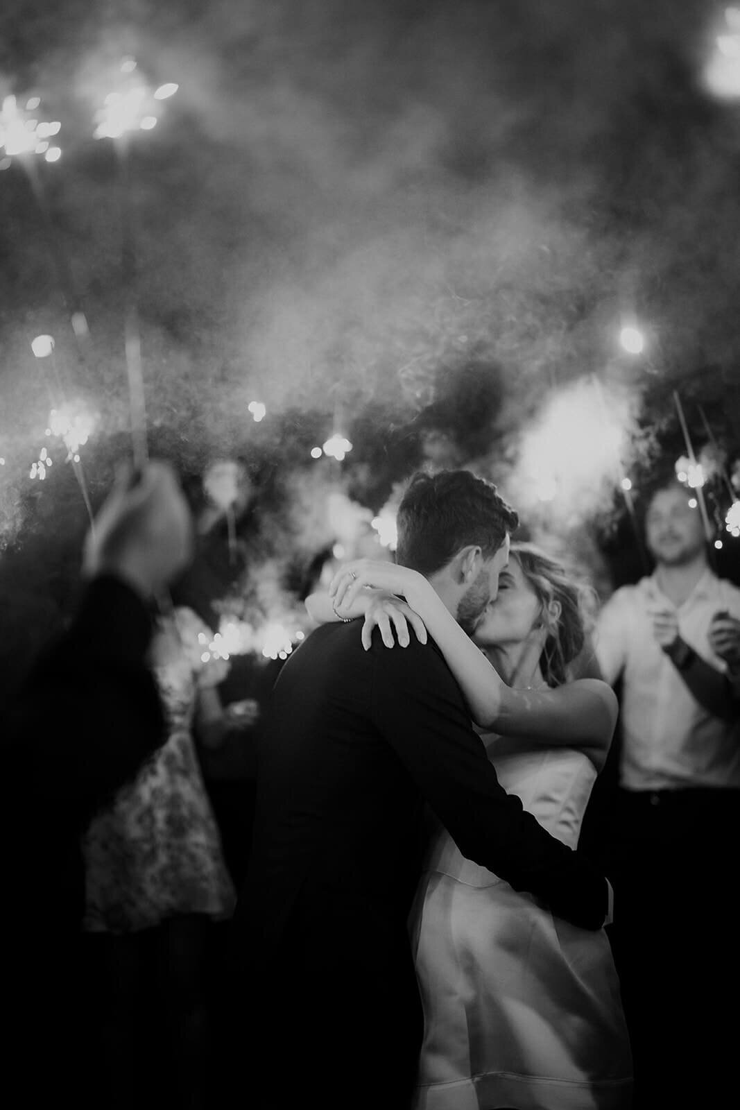Bride and Groom with sparklers in Black and white