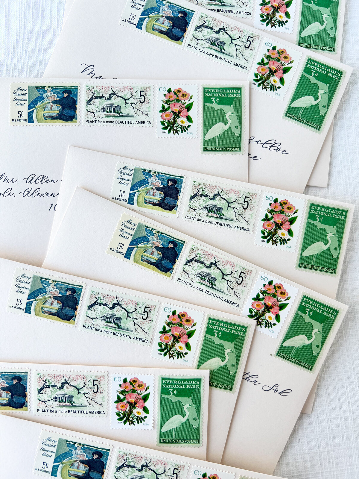 vintage postage stamps on a stack of envelopes