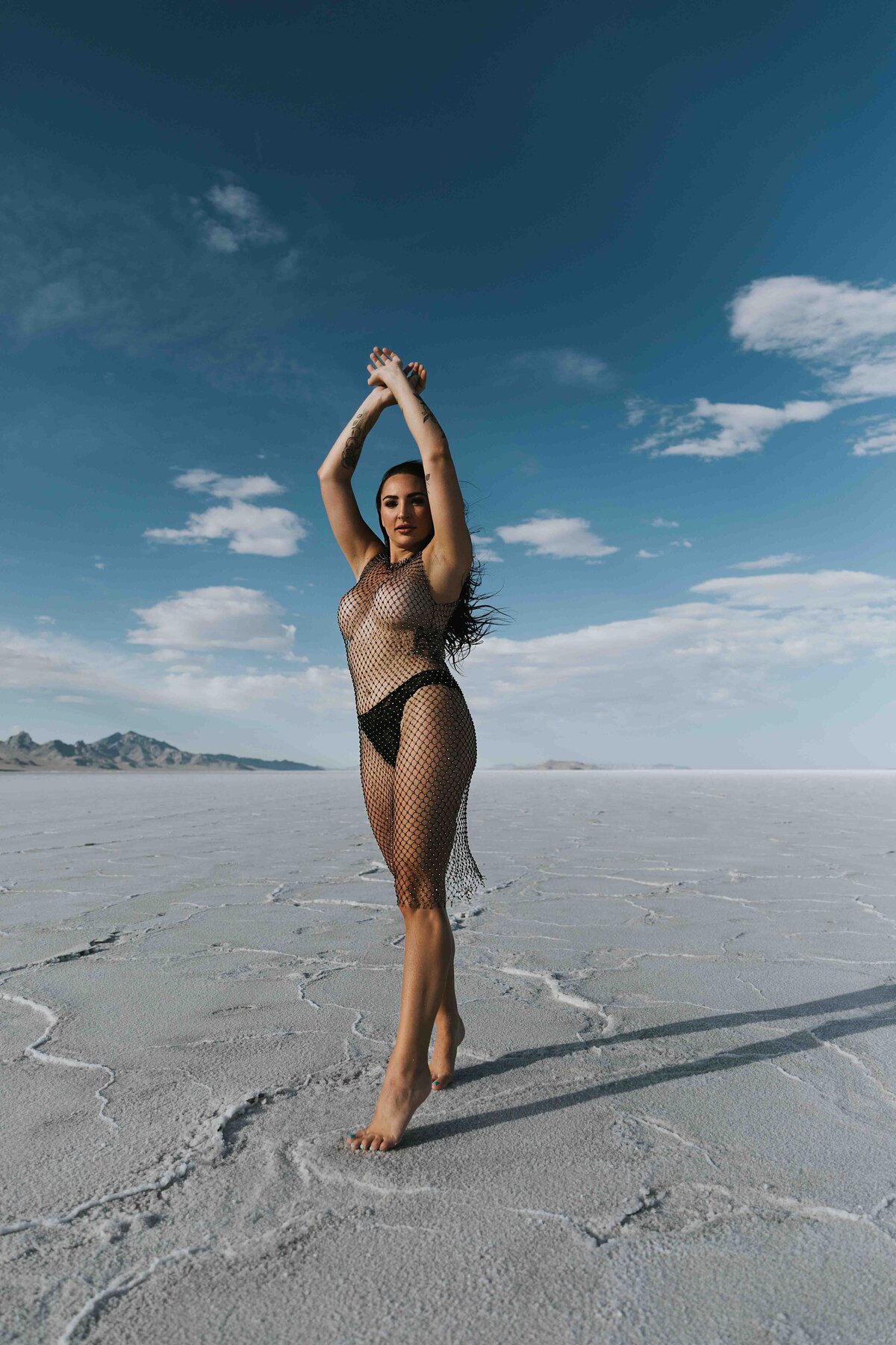 Woman in a netted outfit at the bonneville salt flats