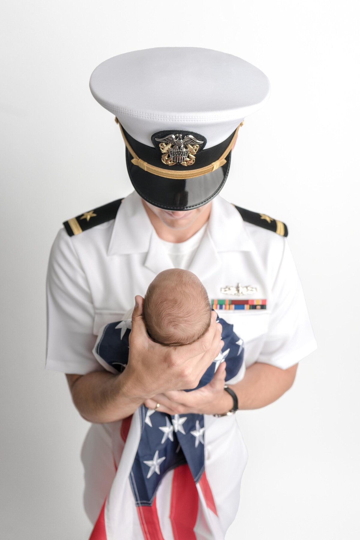 NewDad Dressed In Air Force Uniform Holding Newborn Son