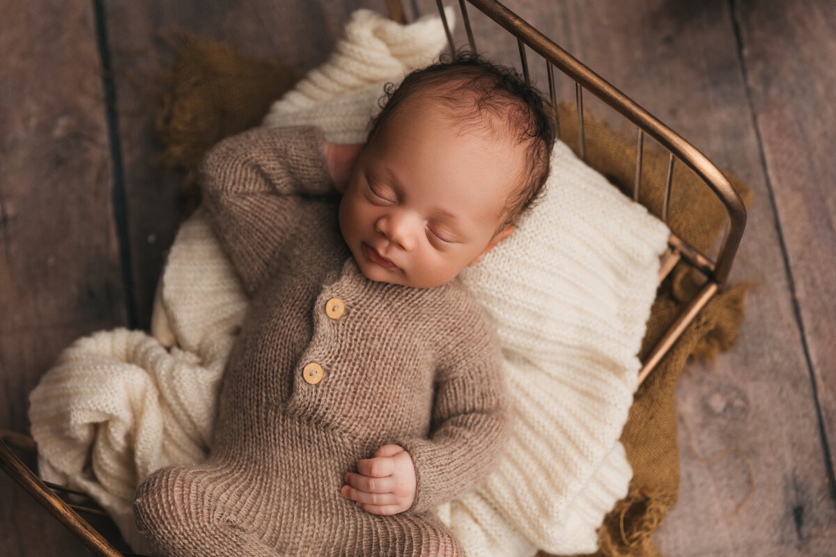 baby posed during phoenix newborn session in studio