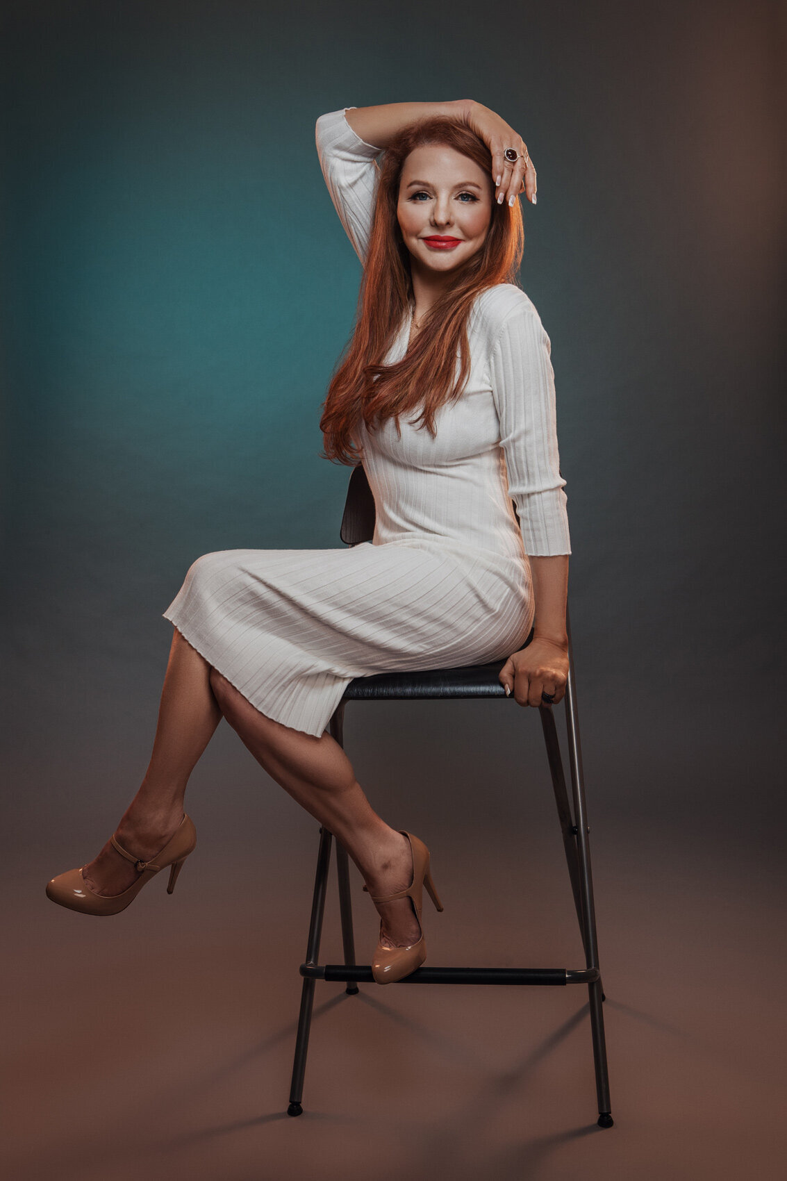Stylish portrait of Andrea Tomasetti in a relaxed pose, wearing a light outfit, captured by Ylva Erevall.
