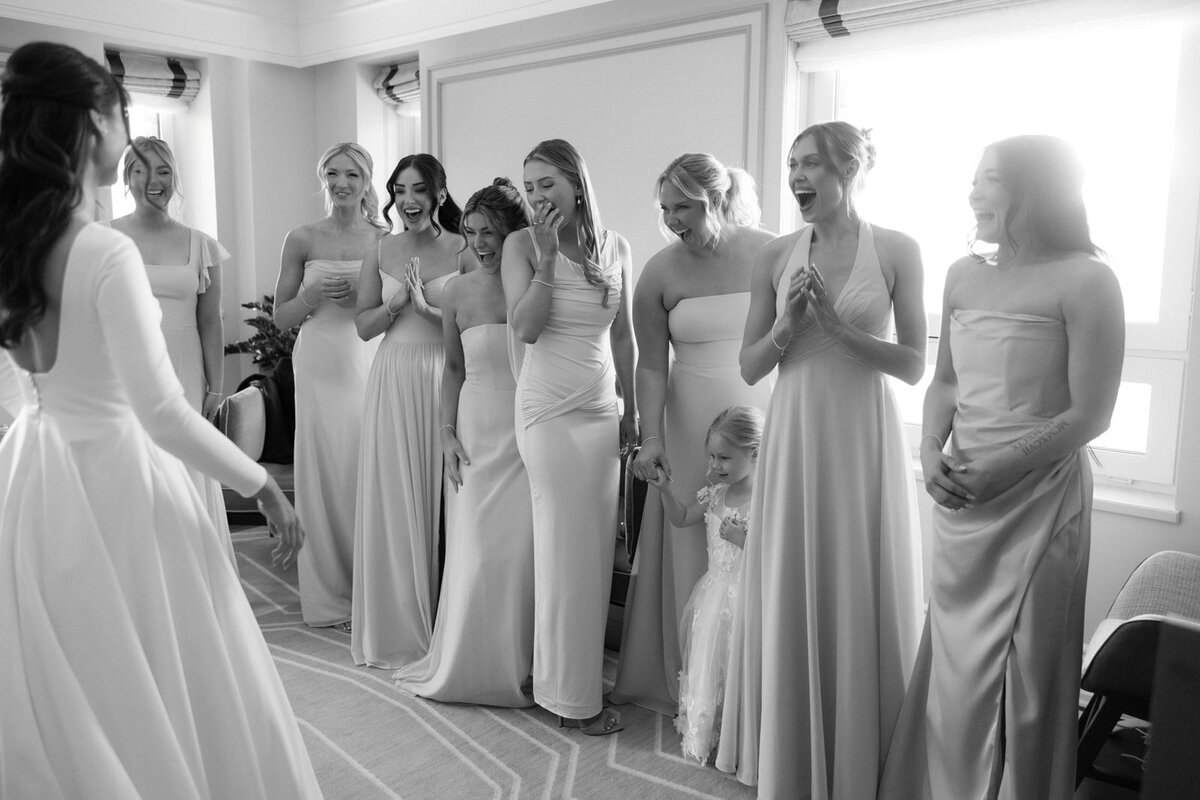 Bridesmaids seeing the bride in her gown for the first time