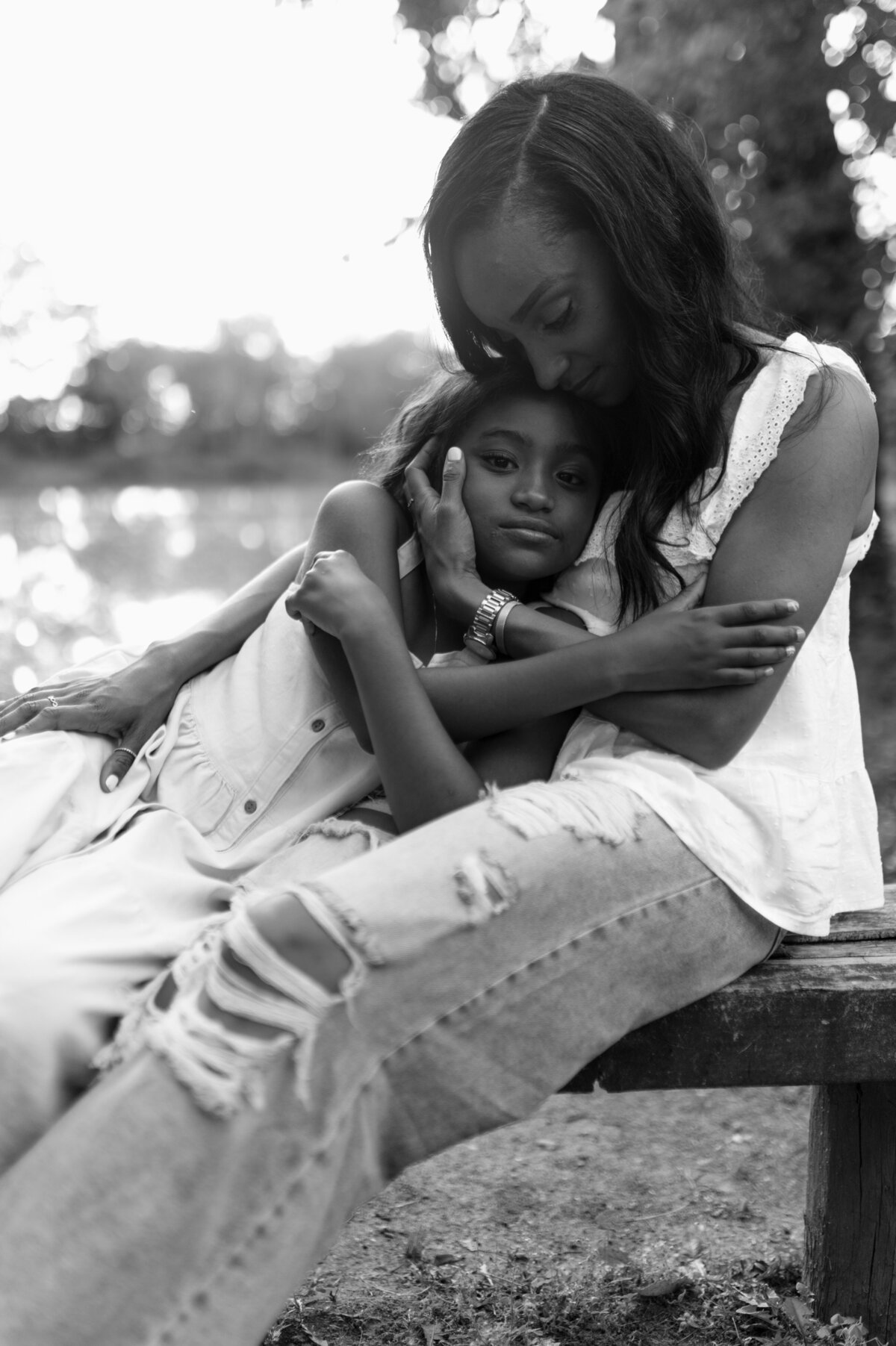 Mother and daughter hugging warmly during a photo session in Doylestown, Pennsylvania