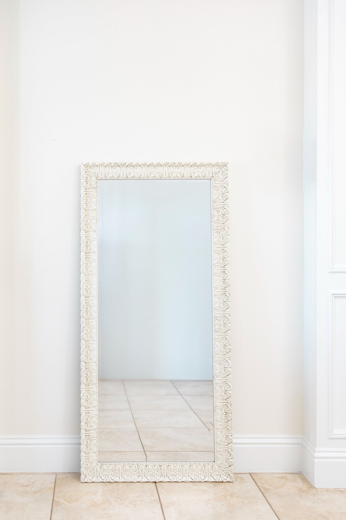 Large white romantic mirror with decorative borders