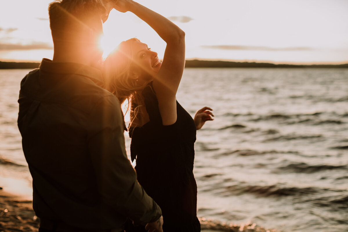 alana-andrew-engagement-cottage-beach-lake-sunset-dock-algonquin-27