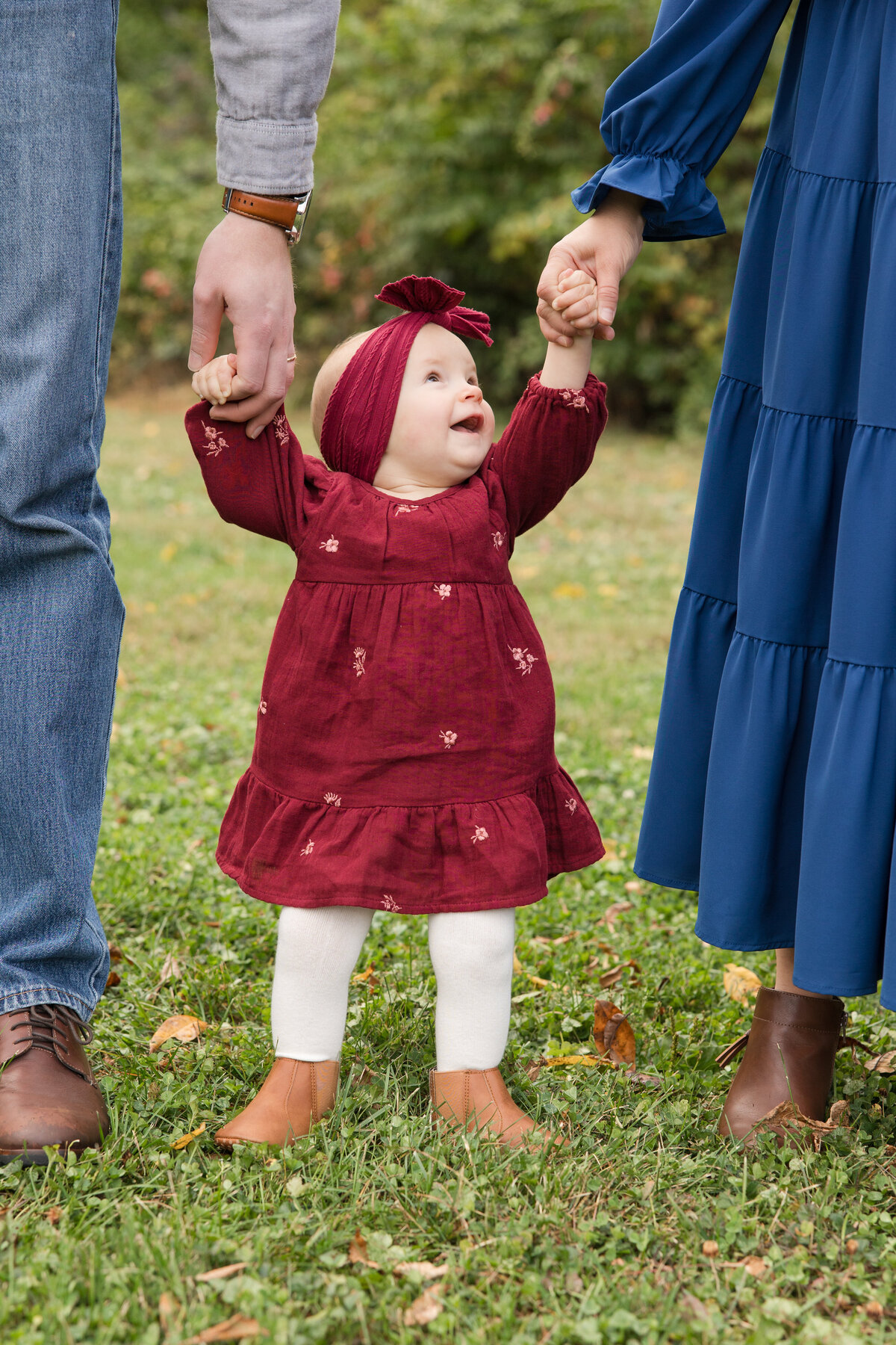 Mom and dad walking with their baby girl