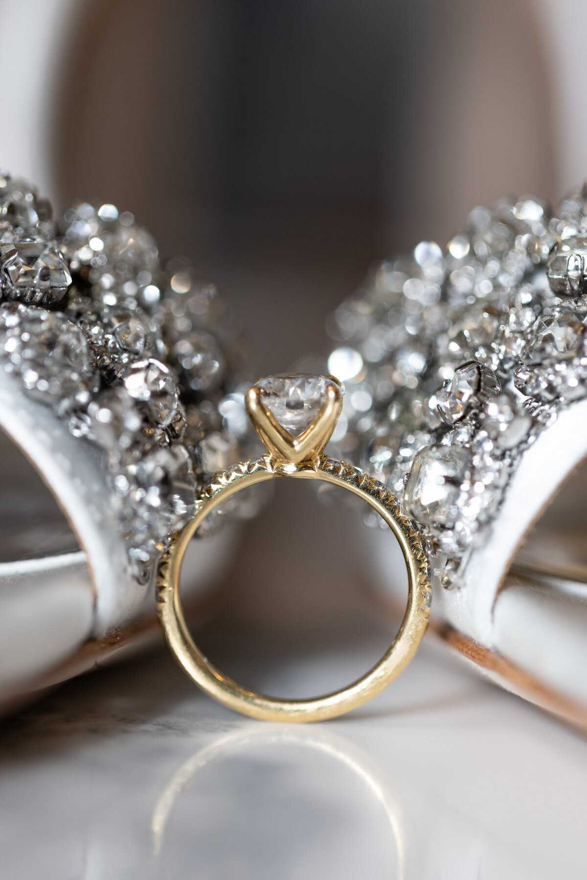 Close up of engagement and silver heels