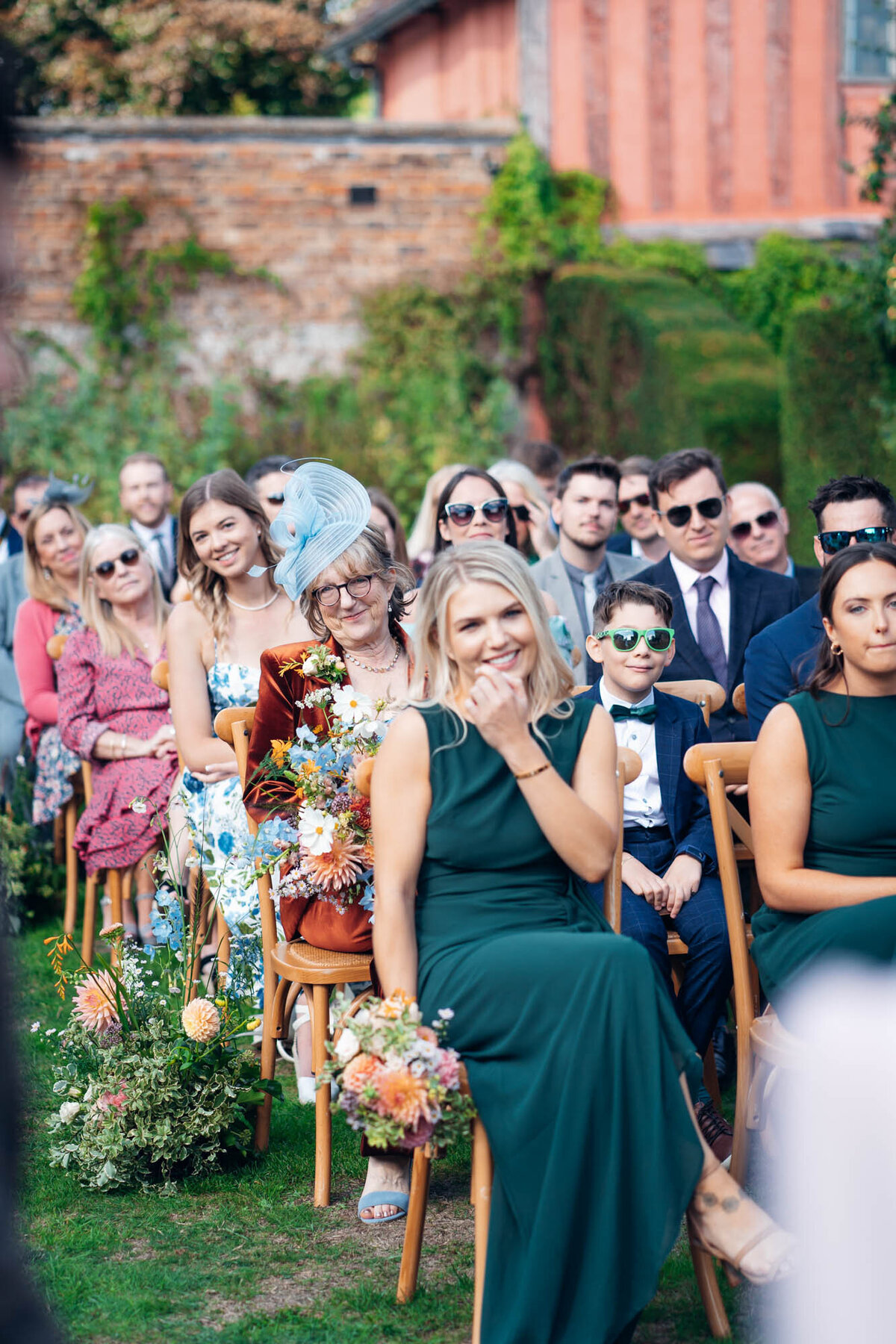 Pauntley-court-wedding-photographer-bridesmaids-during-outdoor-ceremony