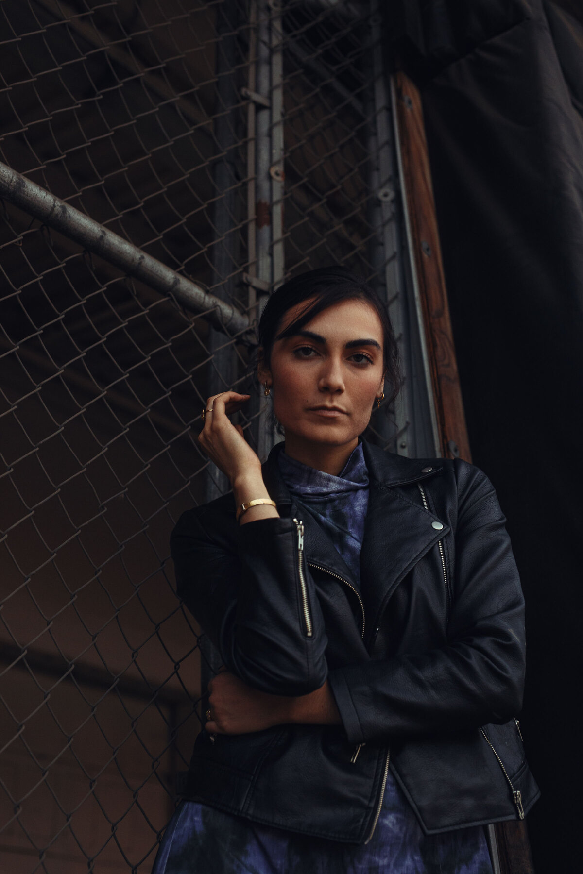 Portrait Photo Of Young Woman In Black Leather Jacket With One Hand On Her Waist Los Angeles
