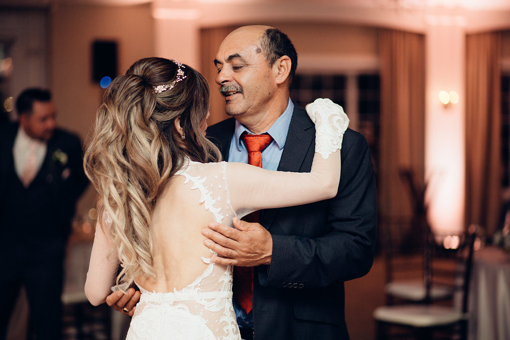 Wedding Photograph Of Bride Dancing With Man In Black And Gray Suit Los Angeles