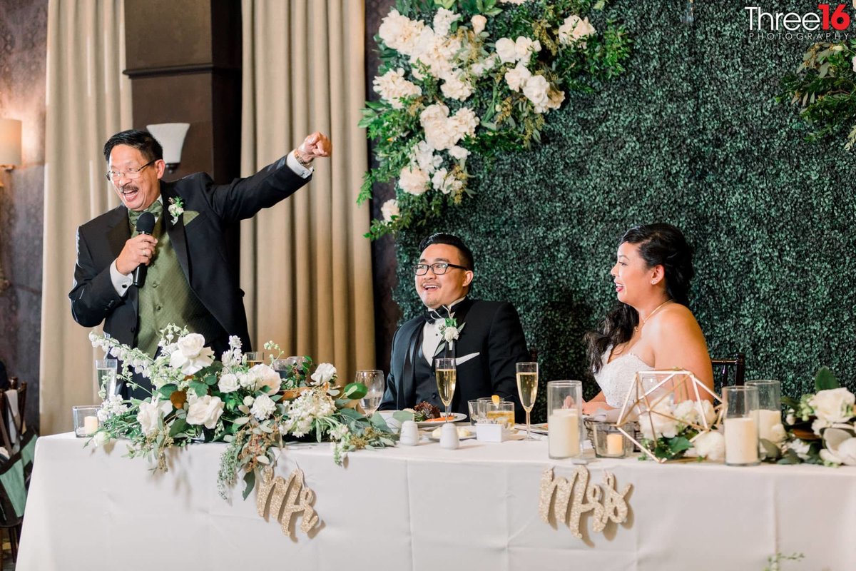 Father of the Bride toasts the newly married couple