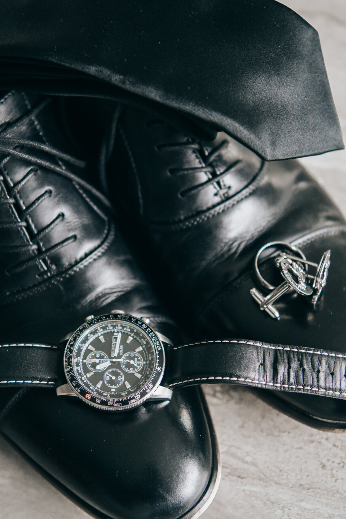 Groom details, shoes, cufflinks, wedding band and watch