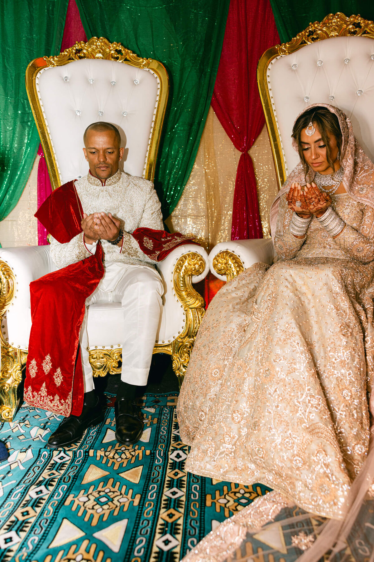 A wedding photo of the couple praying together before the ceremony in Dublin Ireland