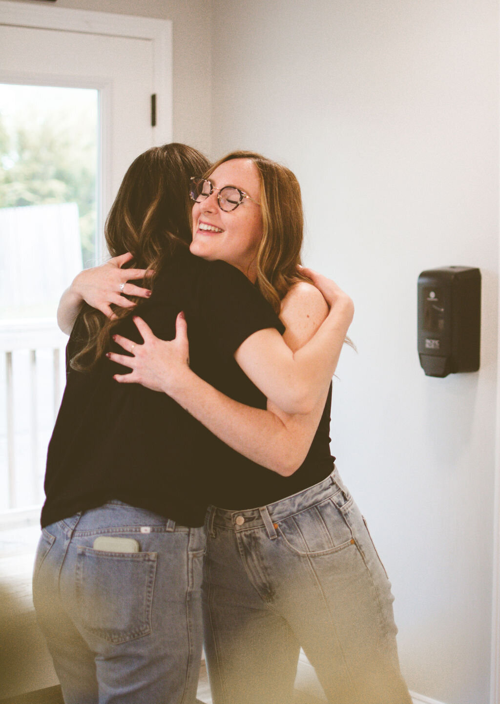 hairstylist hugging client at the end of appointment