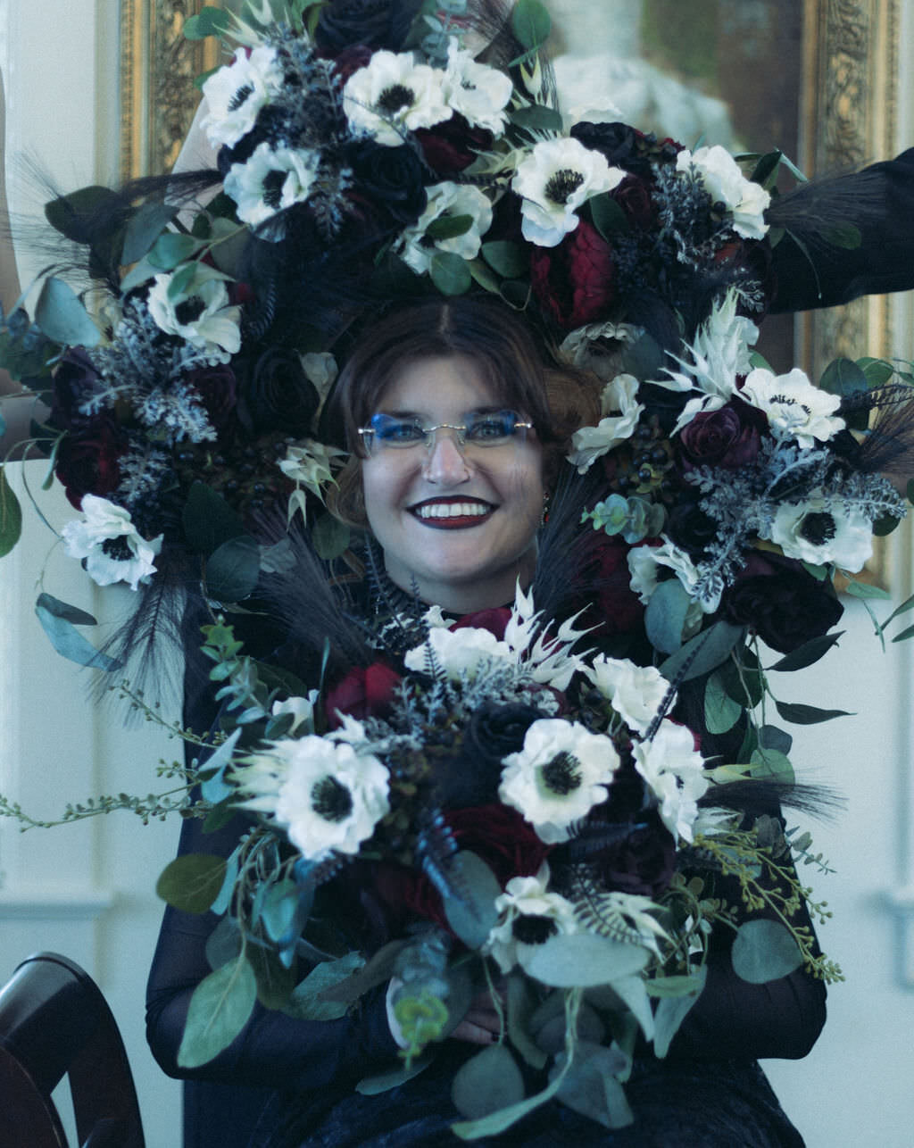 A person with flowers all around their head.