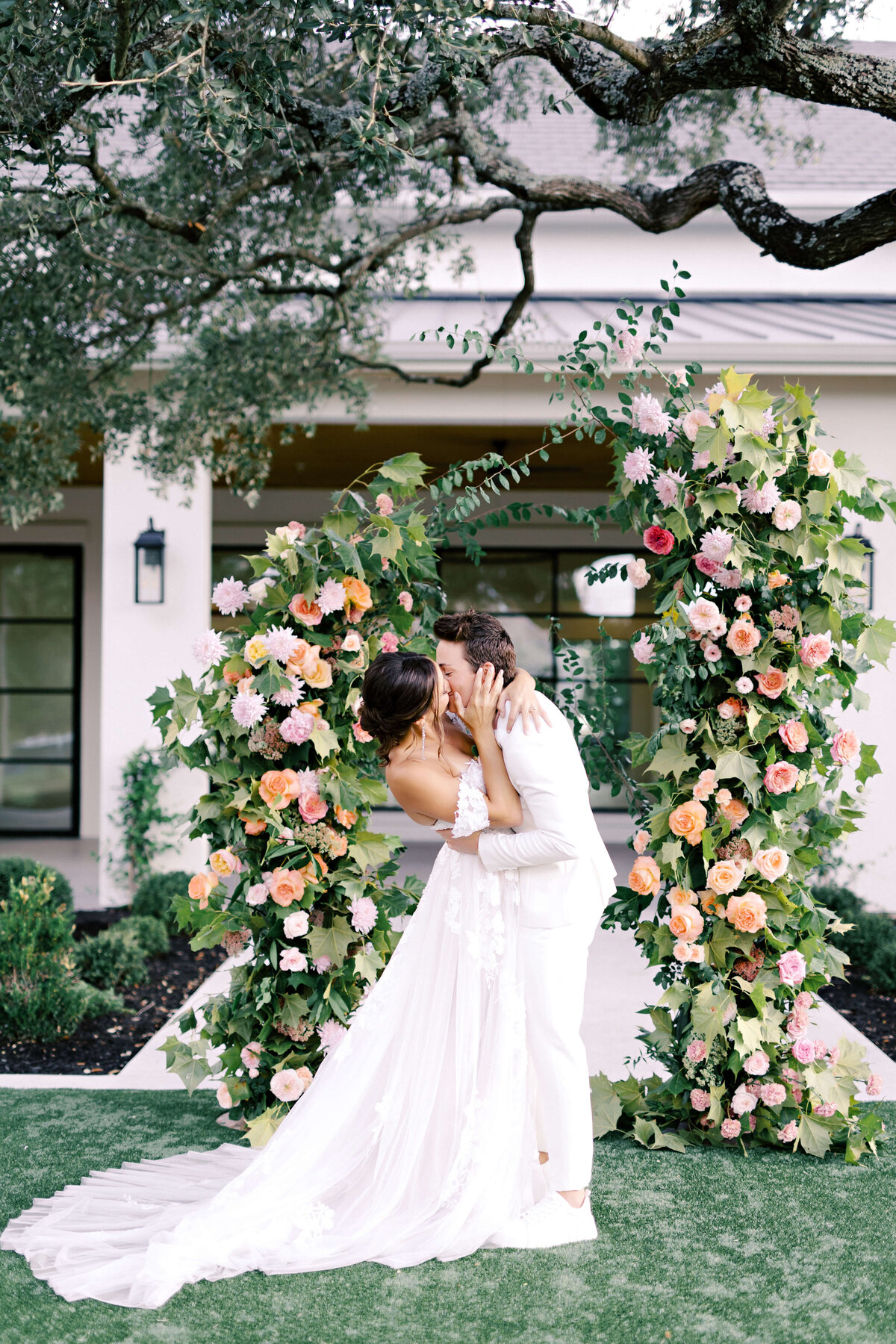 Elopement ceremony with a colorful floral arch
