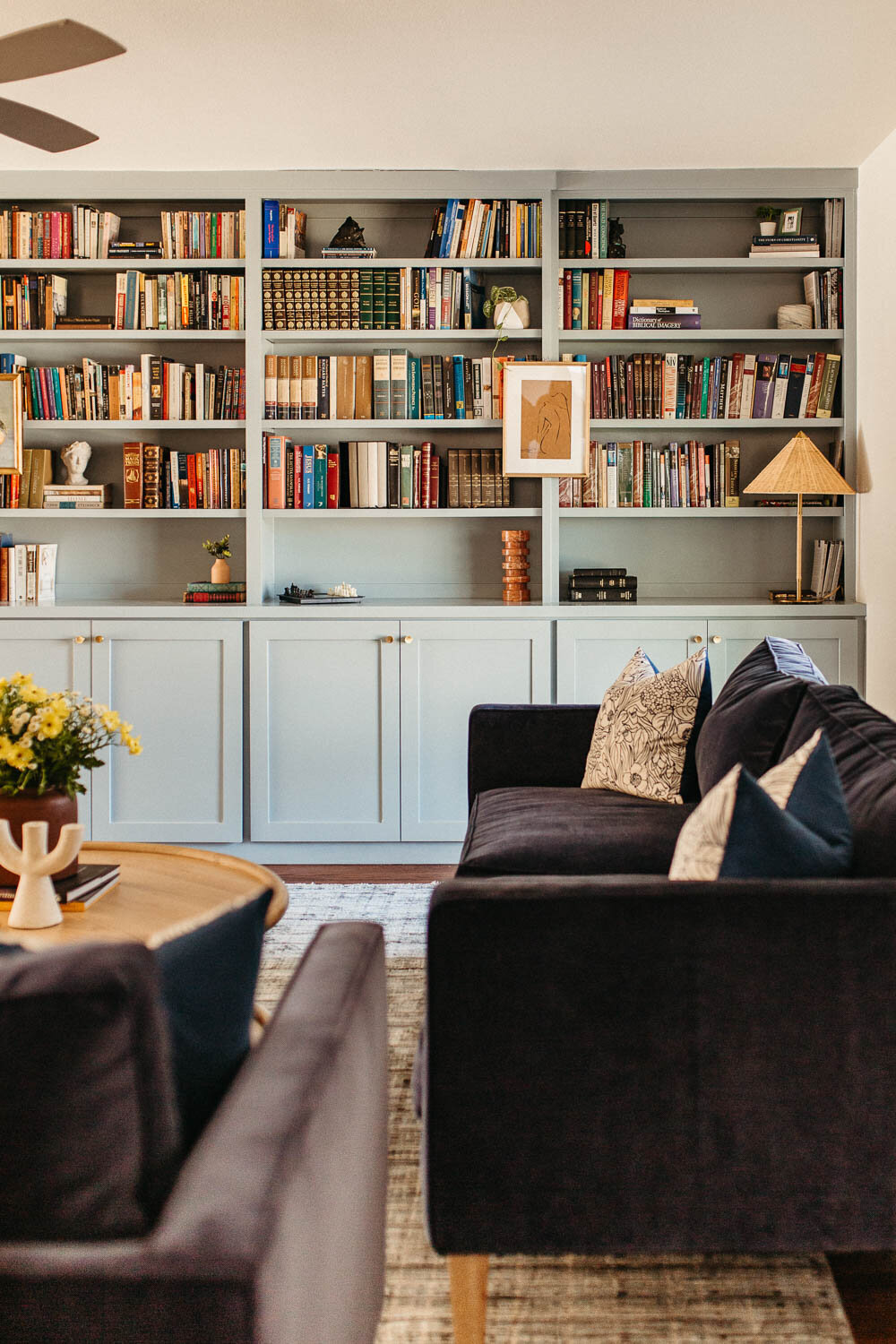 Colorful, warm, classic living room interior designed by Hope Miriam Designs in DFW