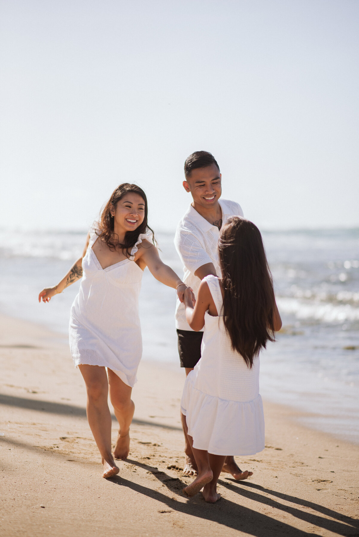 Family Beach Portrait at Barber's Point Lighthouse in Oahu, Hawaii