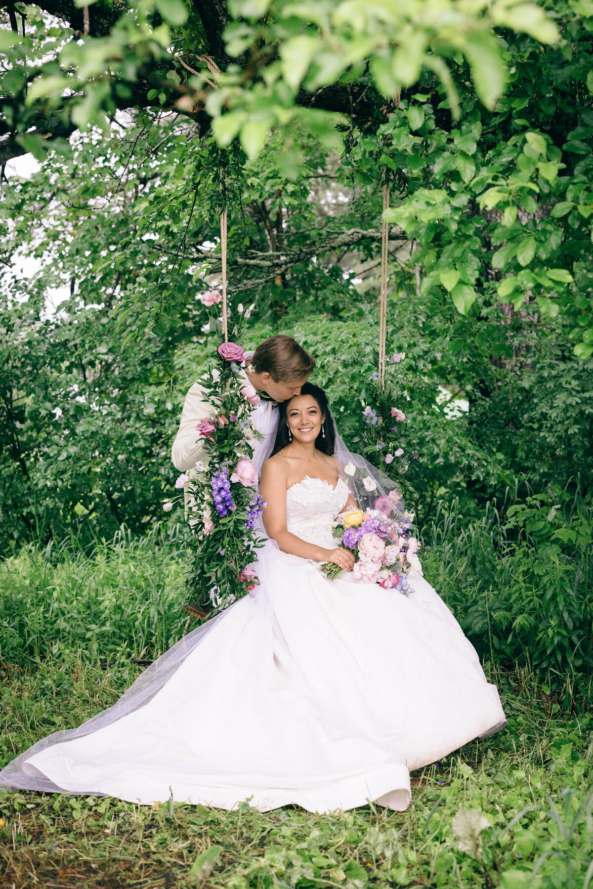 Bride and Groom on Floral Swing