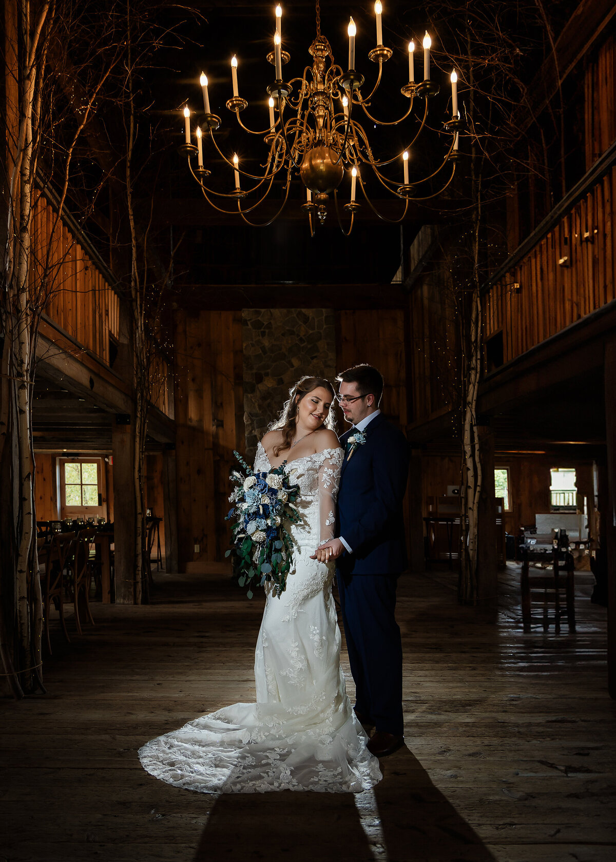 Bride and groom cuddling in cozy quiet moment before reception at NH Barn wedding venue Allrose