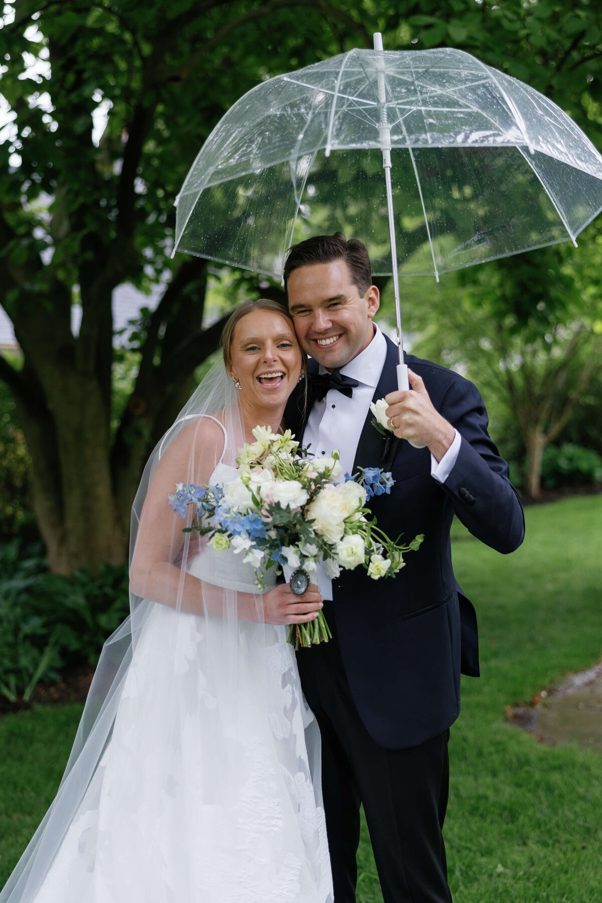 Bride and Groom Portrait in the Rain with Umbrella