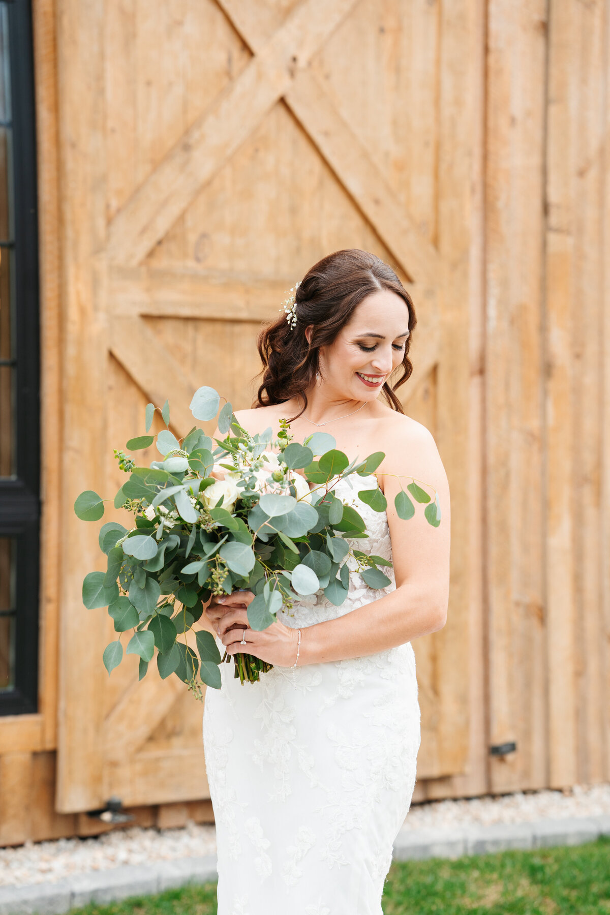 Bride and groom walking hand in hand at their outdoor New England wedding