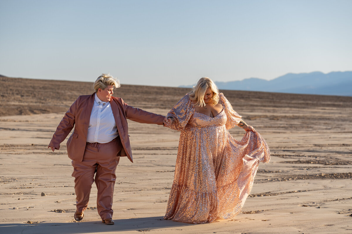 A couple walking along a desert path together