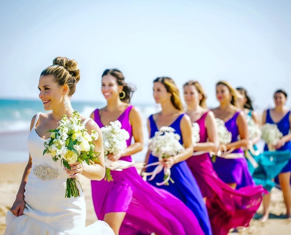 Bride with bridesmaids on the beach at a Sandbridge