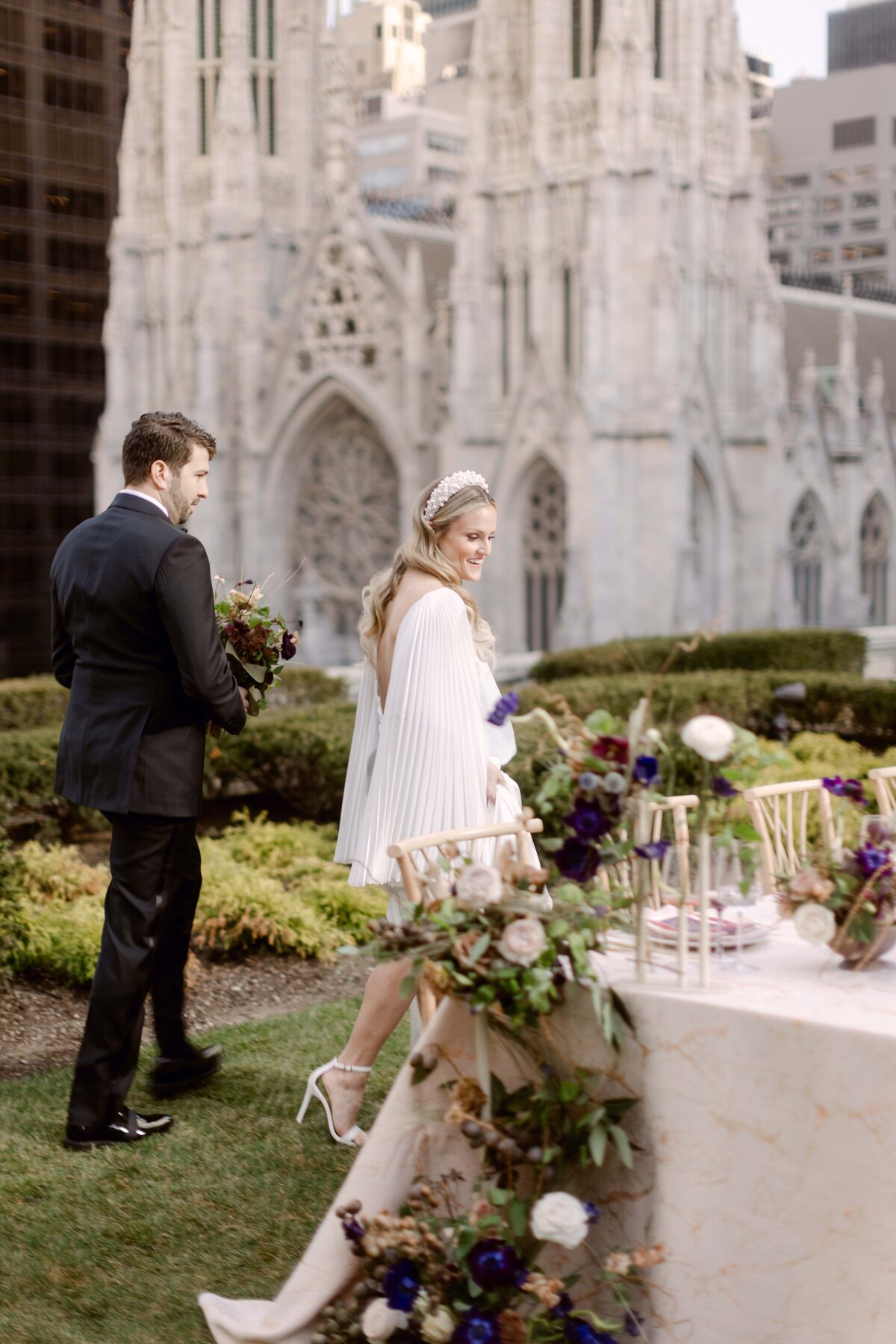 Couple looking at their decorated reception table