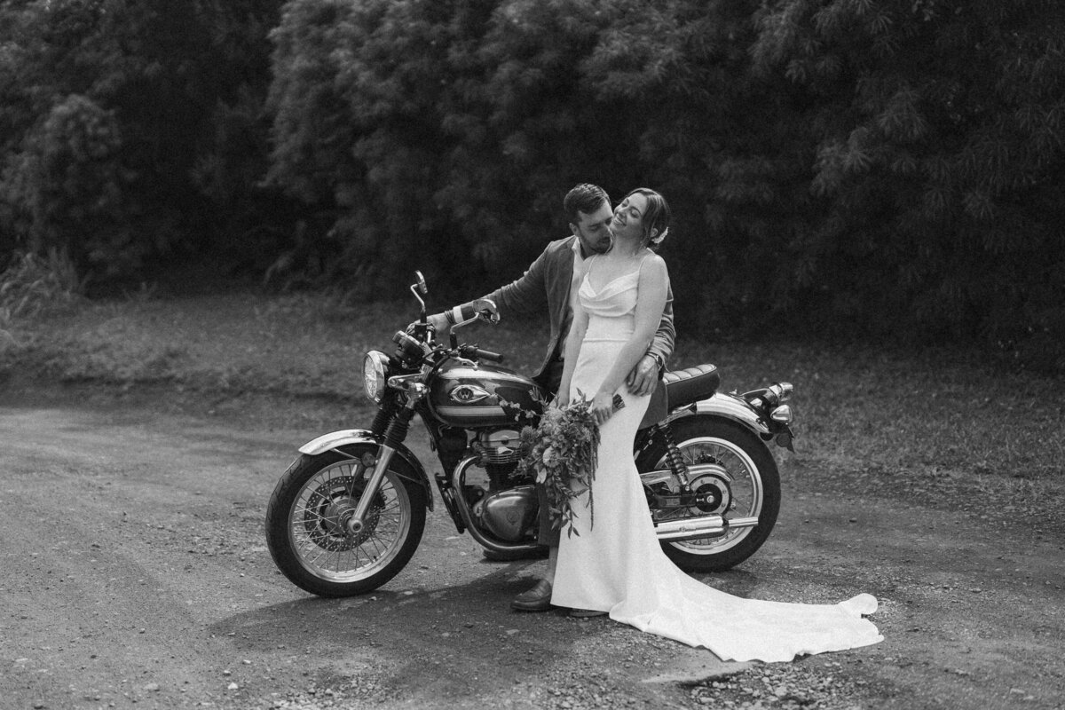 Bride and groom on a motorcycle after their Kauai elopement