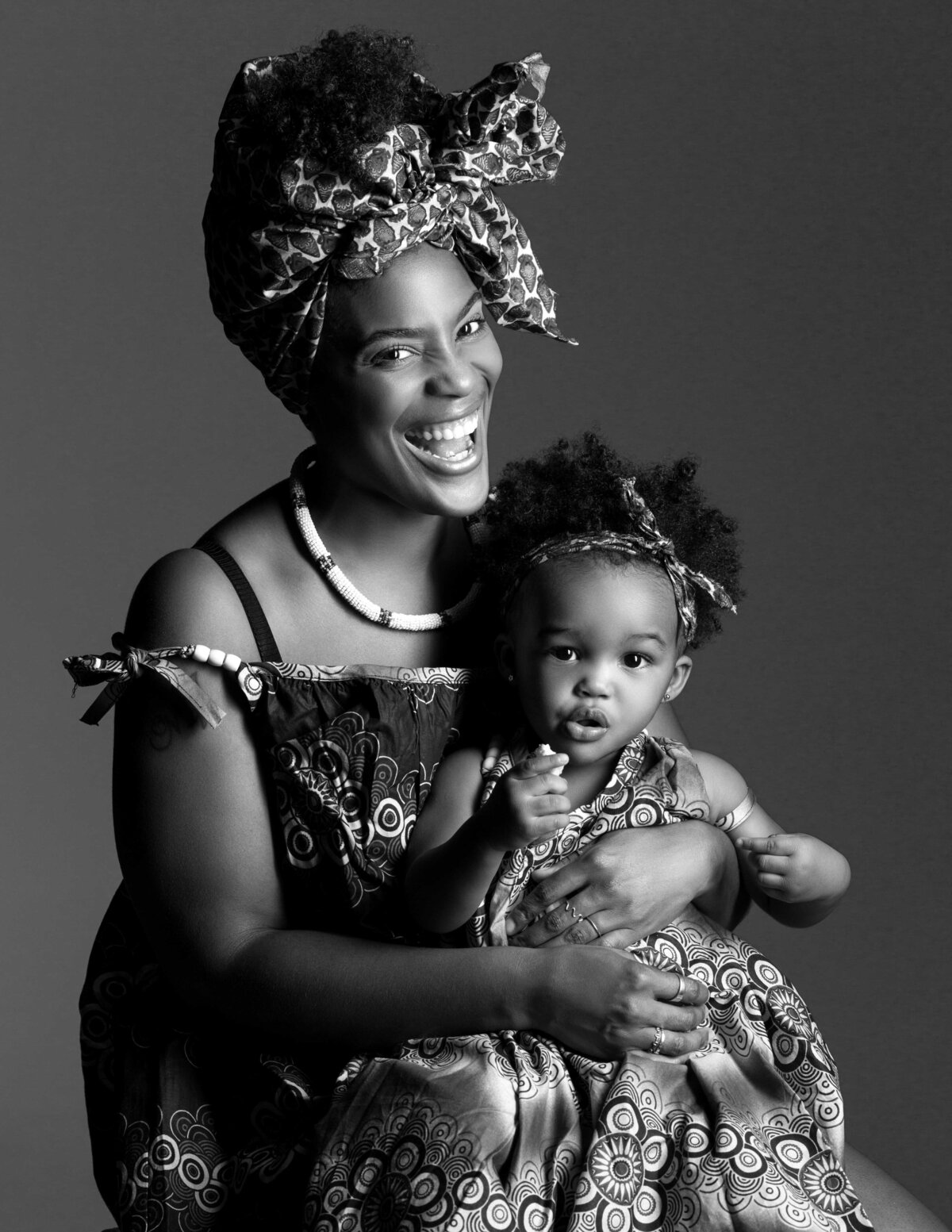 Black and white fashion portrait of a mom and her daughter