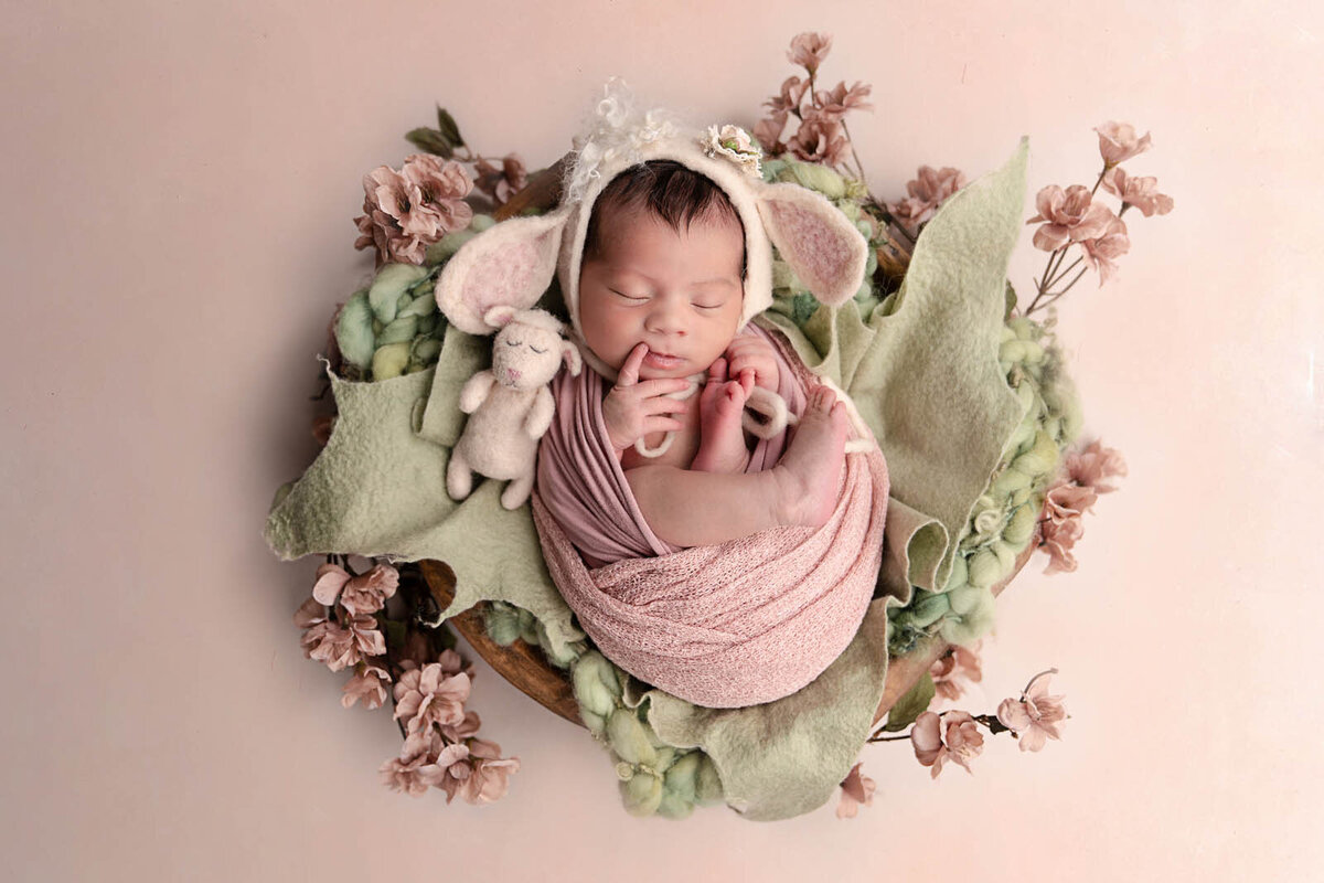 Newborn wrapped and asleep for portrait session
